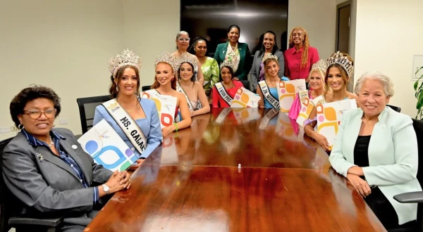 Galaxy International Pageant queens pay a courtesy call on the Minister of Tourism, Glenys Hanna-Martin (right)