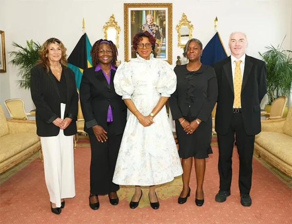 Joan Shannell Evans presents a copy of her book to the Governor General